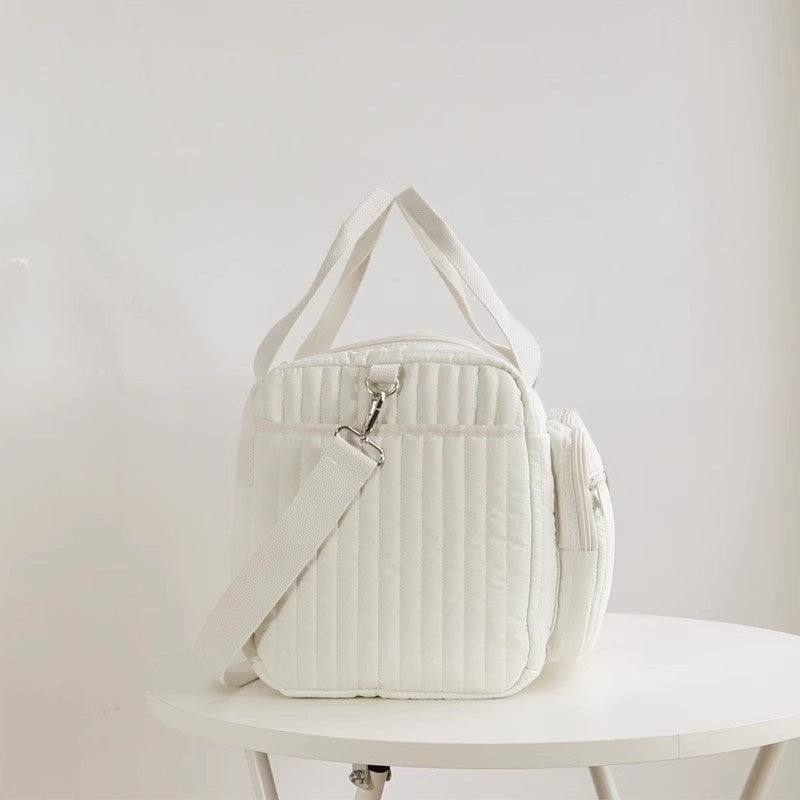 Teddy Cloud Quilted Carryall — side or angled view, supplier photograph