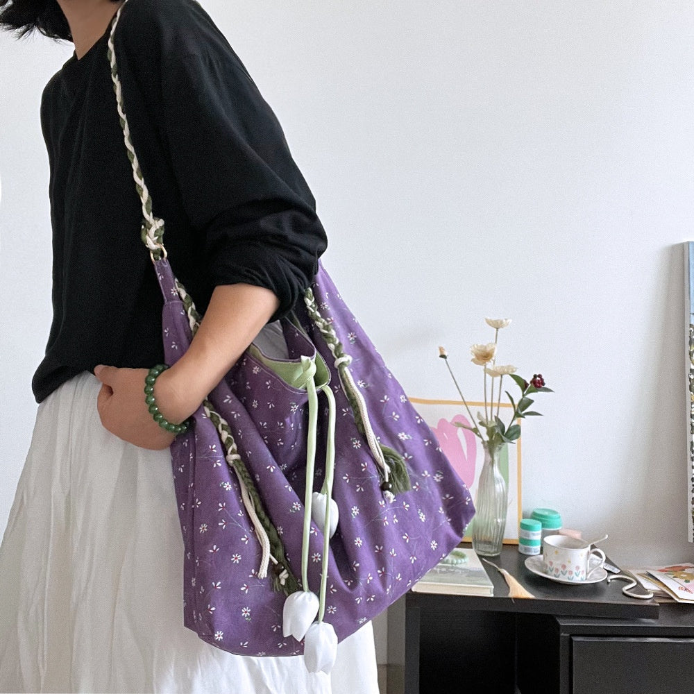 Lilac Meadow Drawstring Hobo — worn or held by a model, supplier photograph